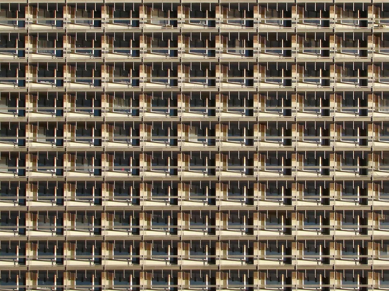 Repeating balcony grid across the full facade