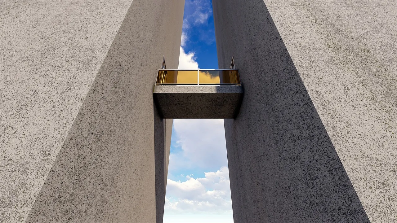 A concrete slot canyon with a suspended walkway