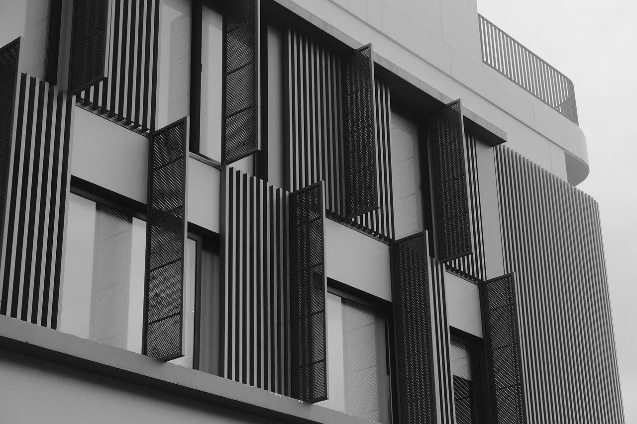 Relief detail of the concrete facade in grey light